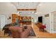 Spacious open-concept living area with kitchen island and bar, hardwood floors, high ceilings and natural light at 195 Connesena Rd, Kingston, GA 30145