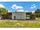Exterior shot of the outbuilding showing covered parking and workshop at 195 Connesena Rd, Kingston, GA 30145