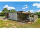 View of outbuilding with covered parking and workshop space at 195 Connesena Rd, Kingston, GA 30145
