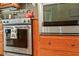KitchenAid stainless steel oven and range with granite countertops and wood cabinets at 195 Connesena Rd, Kingston, GA 30145