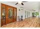 Spacious sunroom with wood-look floors, multiple windows, and access to outdoor space at 195 Connesena Rd, Kingston, GA 30145
