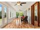 Beautiful sunroom with large windows, inviting seating, and scenic outdoor views at 195 Connesena Rd, Kingston, GA 30145