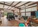 Interior view of workshop with large door, shelving, and ample work space at 195 Connesena Rd, Kingston, GA 30145