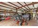 Spacious workshop with large door, shelving, and ample space for equipment at 195 Connesena Rd, Kingston, GA 30145