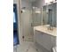 Bathroom with glass enclosed shower, white cabinets and double sink with modern fixtures at 3040 Ivey Oaks Ln, Roswell, GA 30076