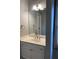 Well-lit bathroom with white vanity, white sink, and a large mirror at 3040 Ivey Oaks Ln, Roswell, GA 30076