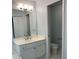 Bright bathroom with a vanity, modern fixtures, and a separate toilet room at 3040 Ivey Oaks Ln, Roswell, GA 30076