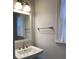 Updated bathroom with a white vanity, framed mirror, and modern lighting at 3040 Ivey Oaks Ln, Roswell, GA 30076