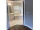 Bathroom featuring a soaking tub, white tile floor, and double sink at 3040 Ivey Oaks Ln, Roswell, GA 30076