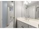 Bathroom with tub/shower combo, white vanity, and neutral decor at 3040 Ivey Oaks Ln, Roswell, GA 30076