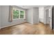 Bedroom with hardwood floors, large windows, and ensuite bathroom at 3040 Ivey Oaks Ln, Roswell, GA 30076