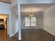 Dining area with hardwood floors, natural light, and access to the kitchen at 3040 Ivey Oaks Ln, Roswell, GA 30076