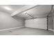 Clean two-car garage with a white door and gray walls at 3040 Ivey Oaks Ln, Roswell, GA 30076