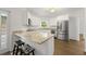 Kitchen with stainless steel appliances, breakfast bar, granite countertops, and backyard access at 3040 Ivey Oaks Ln, Roswell, GA 30076