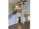 Open-concept living space with hardwood floors, staircase and views of the kitchen at 3040 Ivey Oaks Ln, Roswell, GA 30076