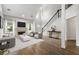 Living room features a fireplace, high ceilings, hardwood floors, and an open concept layout at 3040 Ivey Oaks Ln, Roswell, GA 30076