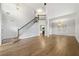 Living room features a fireplace, high ceilings, hardwood floors, and an open concept layout at 3040 Ivey Oaks Ln, Roswell, GA 30076