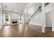 Living room features a fireplace, high ceilings, hardwood floors, and an open concept layout at 3040 Ivey Oaks Ln, Roswell, GA 30076