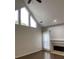 Living room featuring hardwood floors, large windows and a fireplace at 3040 Ivey Oaks Ln, Roswell, GA 30076