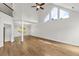 A bright living room features a high ceiling, hardwood floors, and an open floorplan at 3040 Ivey Oaks Ln, Roswell, GA 30076