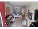 Sunny bedroom with tile floors, a bright red door, and a relaxing atmosphere at 3356 Hollow Ct, Lawrenceville, GA 30044