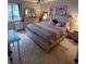 Comfortable bedroom with a full bed, ceiling fan, dresser, and natural light at 3356 Hollow Ct, Lawrenceville, GA 30044