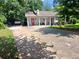 Inviting single-story home with a long driveway and manicured front lawn at 3356 Hollow Ct, Lawrenceville, GA 30044