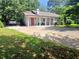 Well-maintained single-story home with a lush lawn, shrubs and inviting front entrance at 3356 Hollow Ct, Lawrenceville, GA 30044