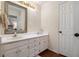 Bathroom with dual sinks, white cabinets, and plenty of storage at 3365 Ne Ivy Lake Drive Northeast Dr, Buford, GA 30519