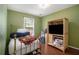 Cozy bedroom featuring hardwood floors, bright natural light from the window and light green walls at 3365 Ne Ivy Lake Drive Northeast Dr, Buford, GA 30519