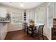 Charming breakfast nook with a round table, three windows and wood floors at 3365 Ne Ivy Lake Drive Northeast Dr, Buford, GA 30519