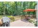 Outdoor deck area surrounded by lush greenery, perfect for enjoying nature at 3365 Ne Ivy Lake Drive Northeast Dr, Buford, GA 30519