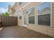 Back deck displaying outdoor access door, wood flooring and railing, and home's exterior siding at 4404 Village Field Pl, Suwanee, GA 30024