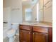 Bathroom featuring wood cabinets and a granite counter at 4404 Village Field Pl, Suwanee, GA 30024