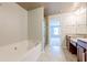 Bathroom features a soaking tub, glass shower, and granite vanity, creating a spa-like experience at 4404 Village Field Pl, Suwanee, GA 30024