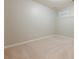 Carpeted bedroom with a small window; the neutral tones of the room provide a blank canvas for personalization at 4404 Village Field Pl, Suwanee, GA 30024