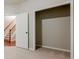 Bedroom featuring walk-in closet with door and staircase with wood banister in the background at 4404 Village Field Pl, Suwanee, GA 30024
