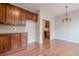 Kitchen and dining area with stainless appliances and dark wood cabinets at 4404 Village Field Pl, Suwanee, GA 30024