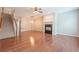 Large living room boasting hardwood floors, a fireplace, staircase and an open layout for entertaining at 4404 Village Field Pl, Suwanee, GA 30024