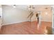 Expansive living room with hardwood floors, fireplace, open layout, staircase, and natural light at 4404 Village Field Pl, Suwanee, GA 30024