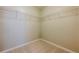 Walk-in closet with carpet flooring and wire shelving at 4404 Village Field Pl, Suwanee, GA 30024