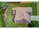 Aerial view of a house with a spacious yard, a storage shed, and a well-manicured lawn at 206 Traditions Dr, Loganville, GA 30052
