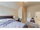 Bedroom featuring a bed with workspace, with two doors and plush carpeting throughout at 206 Traditions Dr, Loganville, GA 30052