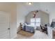 Cozy bedroom with vaulted ceilings, a basketball-themed wall decal, and a bed with desk setup at 206 Traditions Dr, Loganville, GA 30052
