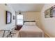 Bright bedroom with a full bed and unique wall decor with a desk by the window at 206 Traditions Dr, Loganville, GA 30052