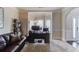 Comfortable home office space with a large desk, bay window, and view of the front yard at 206 Traditions Dr, Loganville, GA 30052
