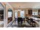 Bright kitchen featuring granite countertops, stainless steel appliances, and a dining area at 206 Traditions Dr, Loganville, GA 30052