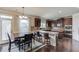 Spacious kitchen with stainless steel appliances, granite countertops, and a breakfast bar at 206 Traditions Dr, Loganville, GA 30052