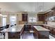 Chef's kitchen featuring an island, breakfast bar, granite counters, and stainless appliances at 206 Traditions Dr, Loganville, GA 30052