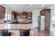 Well-equipped kitchen with stainless steel appliances, granite countertops, and ample cabinetry at 206 Traditions Dr, Loganville, GA 30052